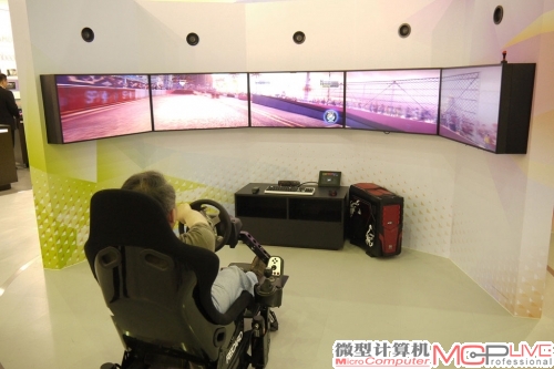 AMD展台展出的5连屏赛车游戏，除了游戏视觉逼真外，赛车椅也能实时动态变化。